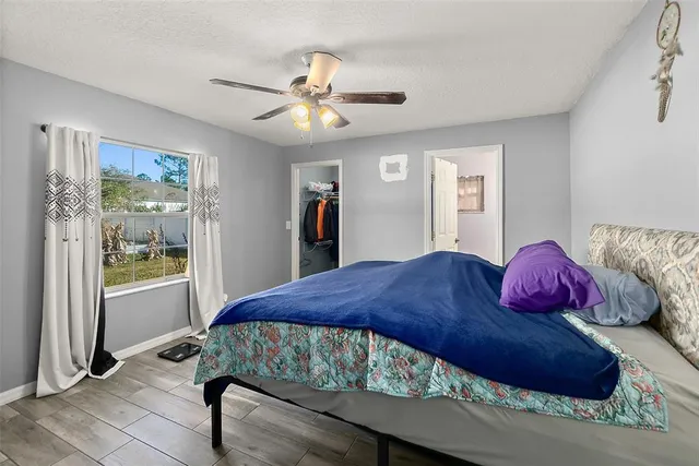 a bedroom with a bed and window