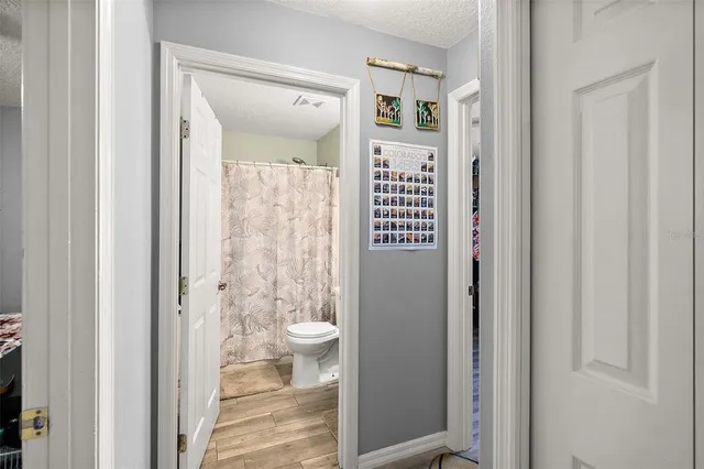 a view of a bathroom from a hallway