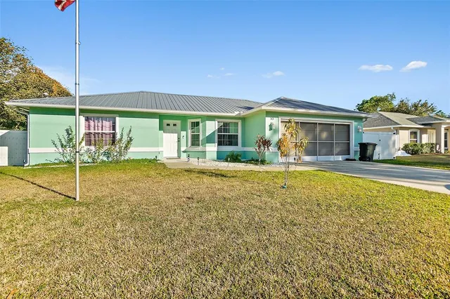 a swimming pool with outdoor seating and yard
