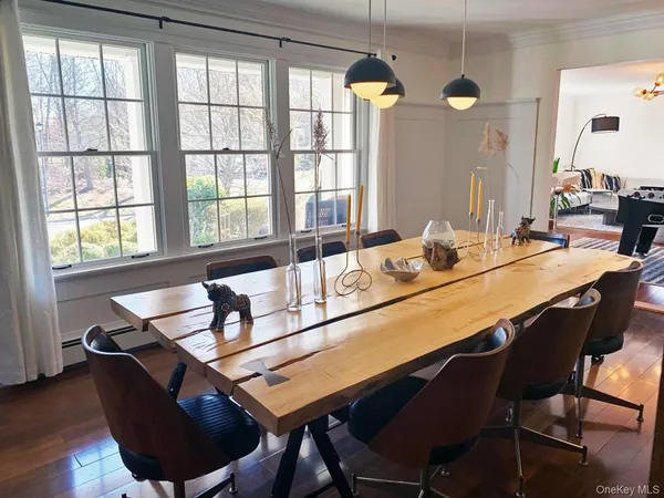 a dining room with furniture and window