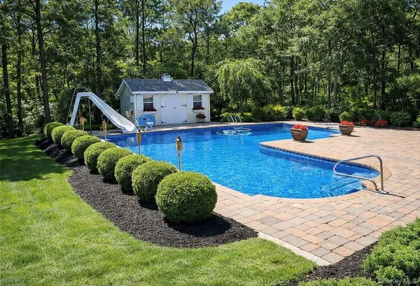 a view of a chairs in a backyard