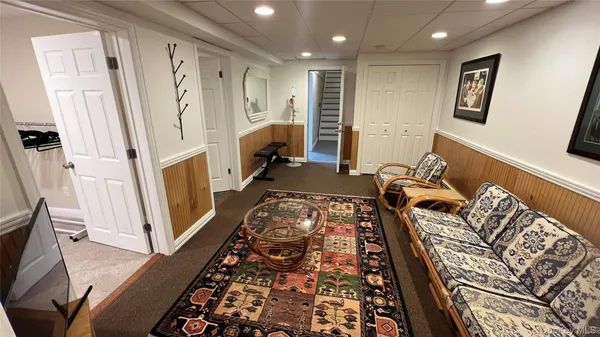 a bedroom with a bed and a couch