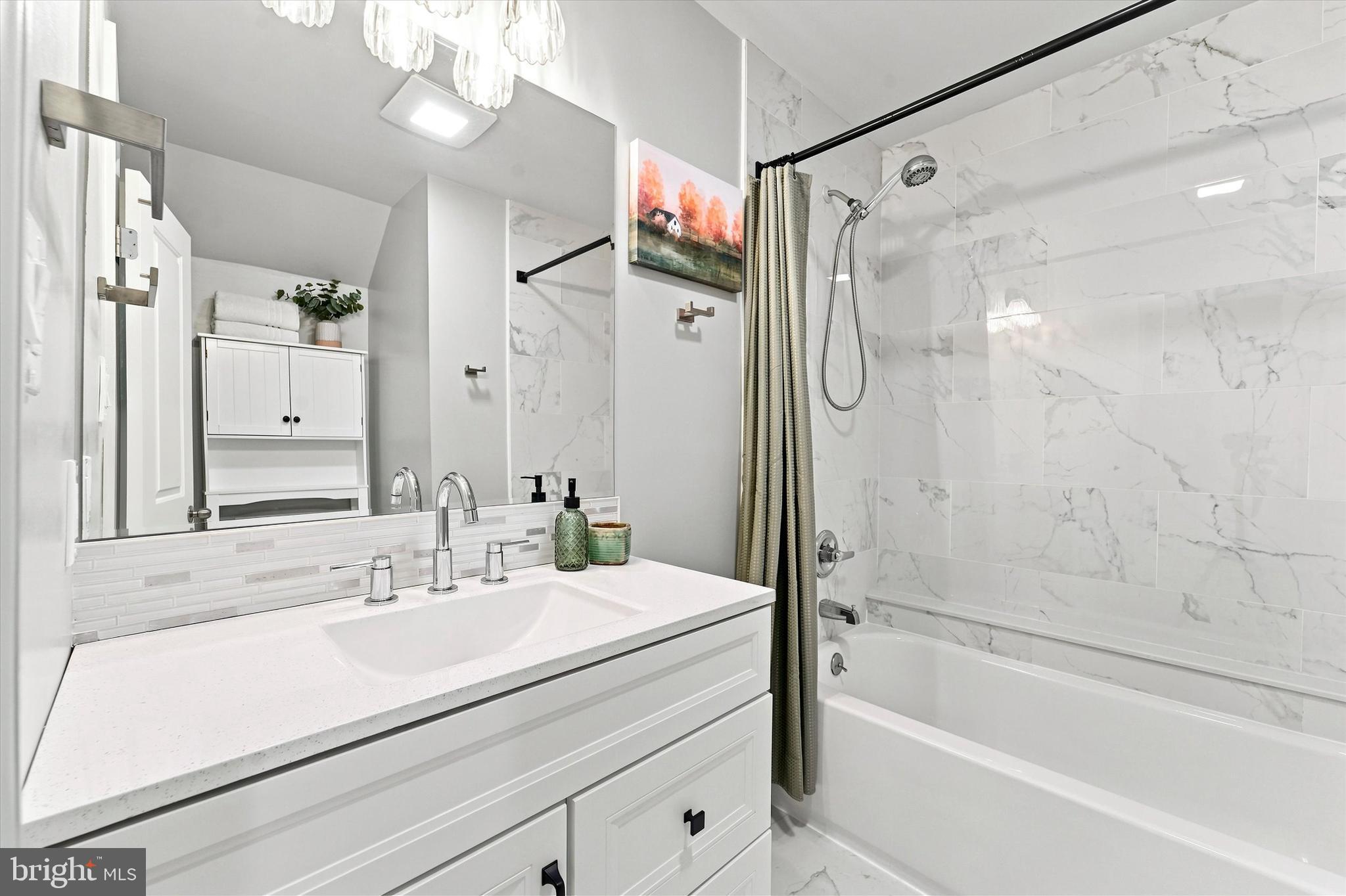 135 Rutledge Avenue Rutledge, PA 19070 - Photo 23 of 42 a bathroom with a tub sink shower and mirror