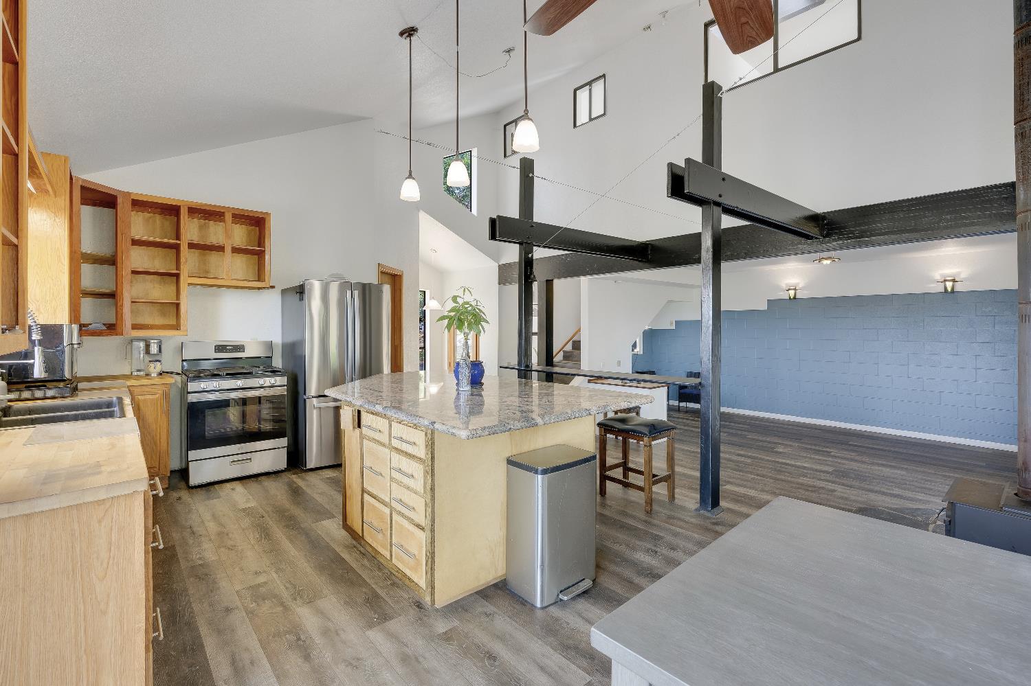 2261 Sand Ridge Road El Dorado, CA 95623 - Photo 14 of 61 a kitchen with stainless steel appliances granite countertop a sink a stove and a wooden floors