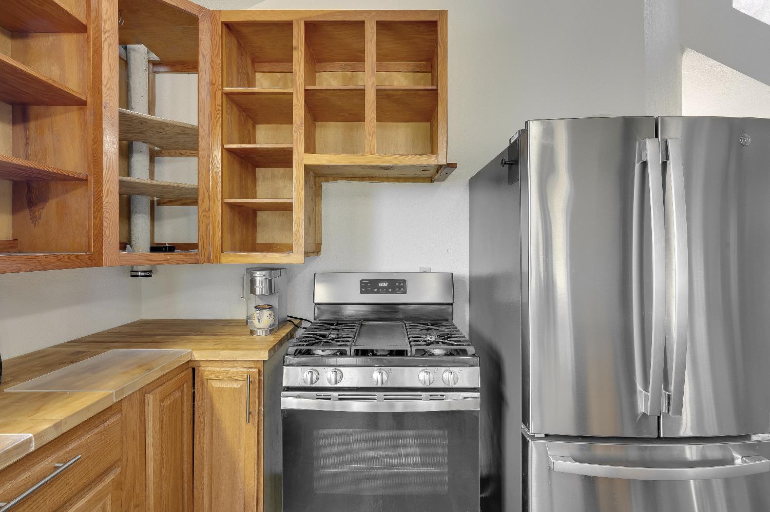 2261 Sand Ridge Road El Dorado, CA 95623 - Photo 16 of 61 a kitchen with a stove and a refrigerator