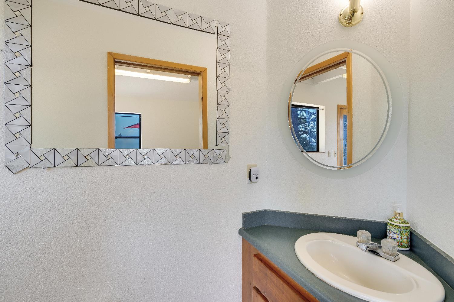 2261 Sand Ridge Road El Dorado, CA 95623 - Photo 21 of 61 a bathroom with a sink and a mirror