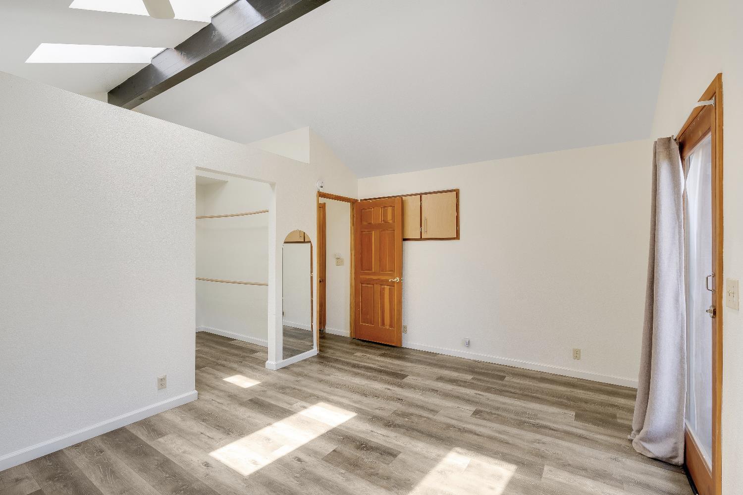 2261 Sand Ridge Road El Dorado, CA 95623 - Photo 23 of 61 a view of a room with wooden floor and white doors