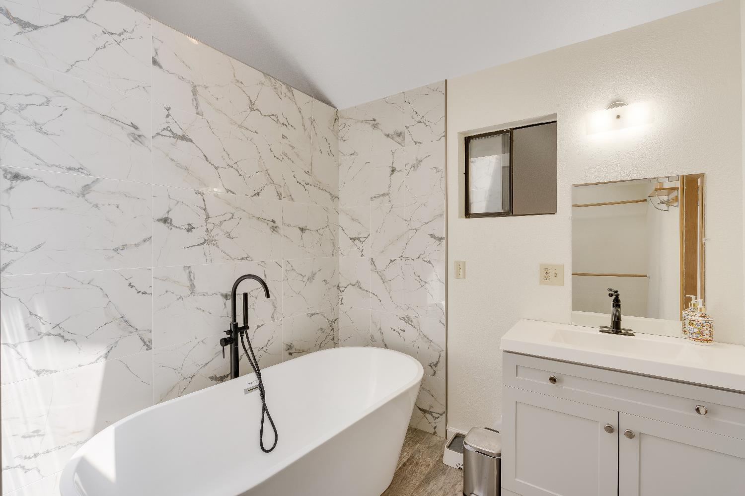 2261 Sand Ridge Road El Dorado, CA 95623 - Photo 25 of 61 a bathroom with a sink and a bathtub