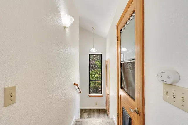 a bathroom with a shower and a toilet