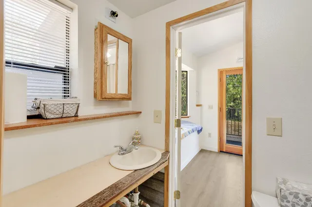 a view of a house with a wooden fence