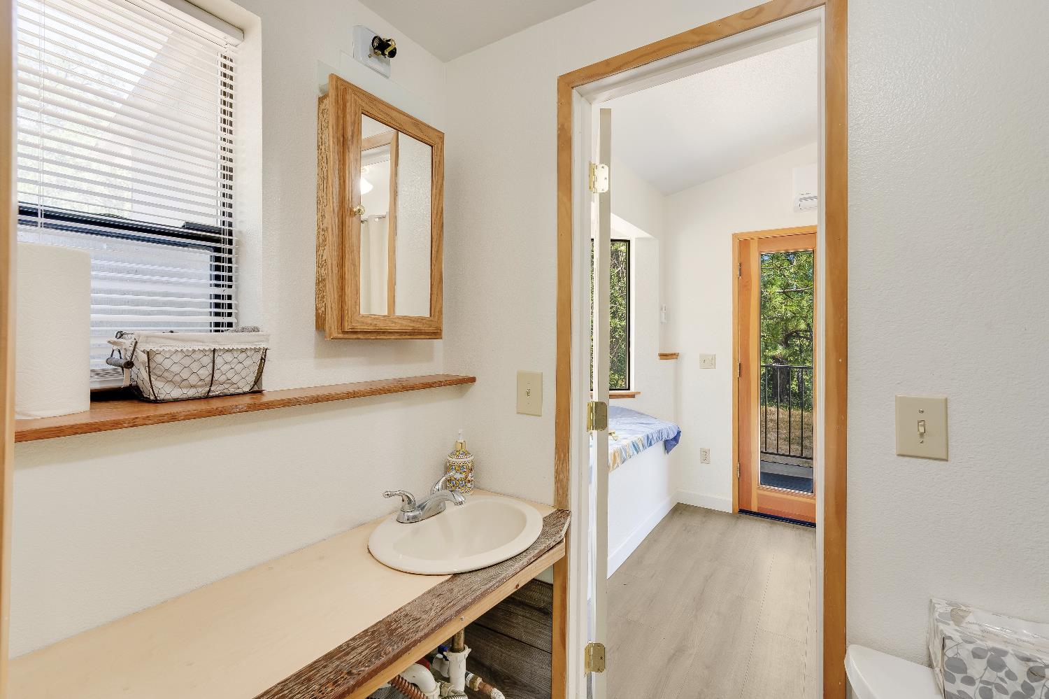 2261 Sand Ridge Road El Dorado, CA 95623 - Photo 32 of 61 a bathroom with a granite countertop sink and a mirror