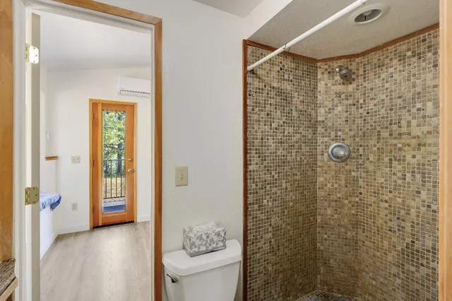a view of balcony with wooden floor and fence