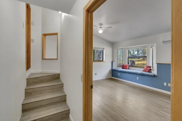 a view of a two chairs on the roof deck