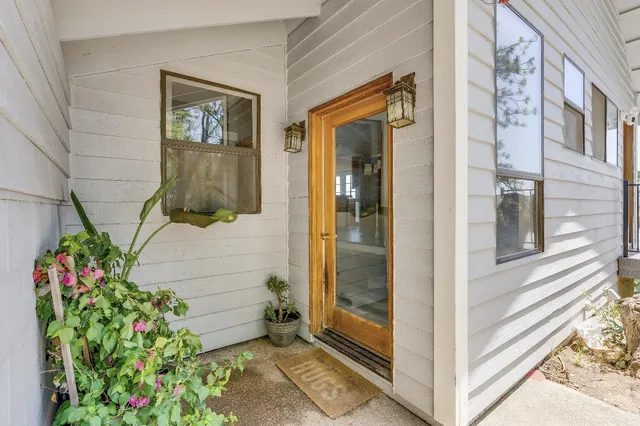 a view of an entryway with wooden floor and windows