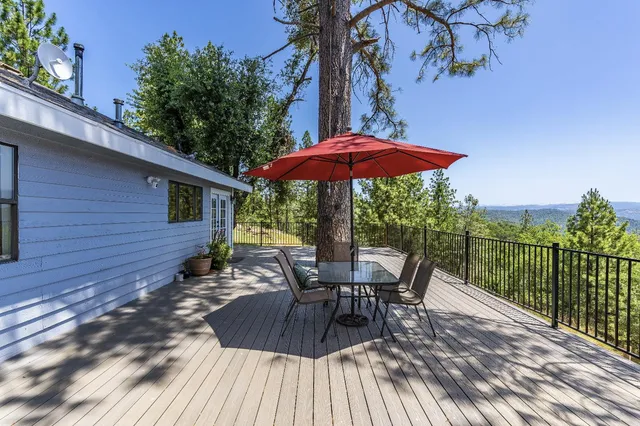 an aerial view of a house with a yard and garden