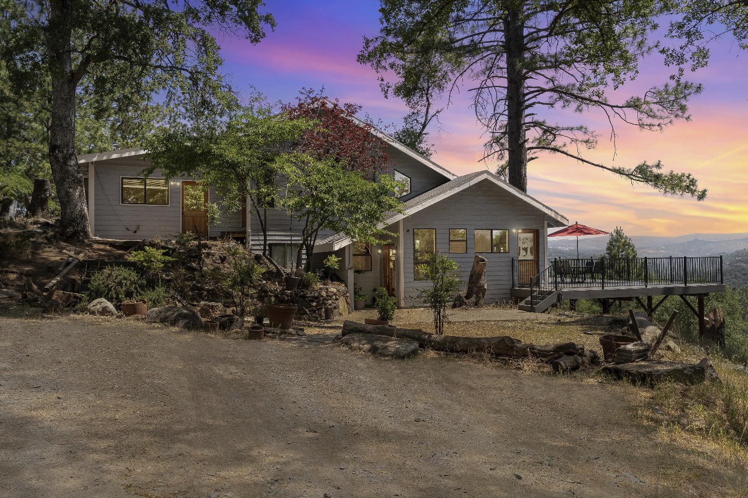 2261 Sand Ridge Road El Dorado, CA 95623 - Photo 60 of 61 a front view of a house with sitting area and garden