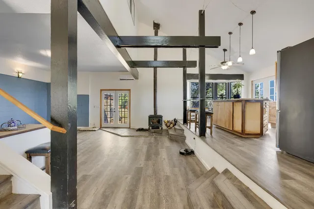 a view of a livingroom with furniture and a workspace
