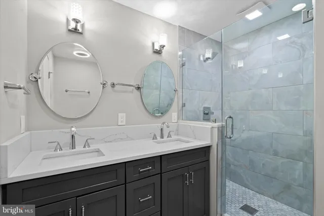 a bathroom with a double vanity sink and a mirror
