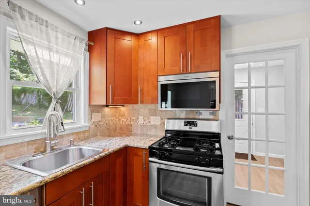 a kitchen with a stove and a sink