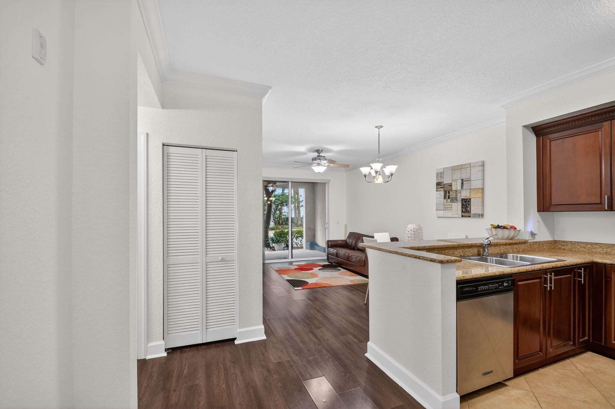3110 Renaissance Way, Unit 110 Boynton Beach, FL 33426 - Photo 13 of 45 a kitchen with a stove a sink and a refrigerator