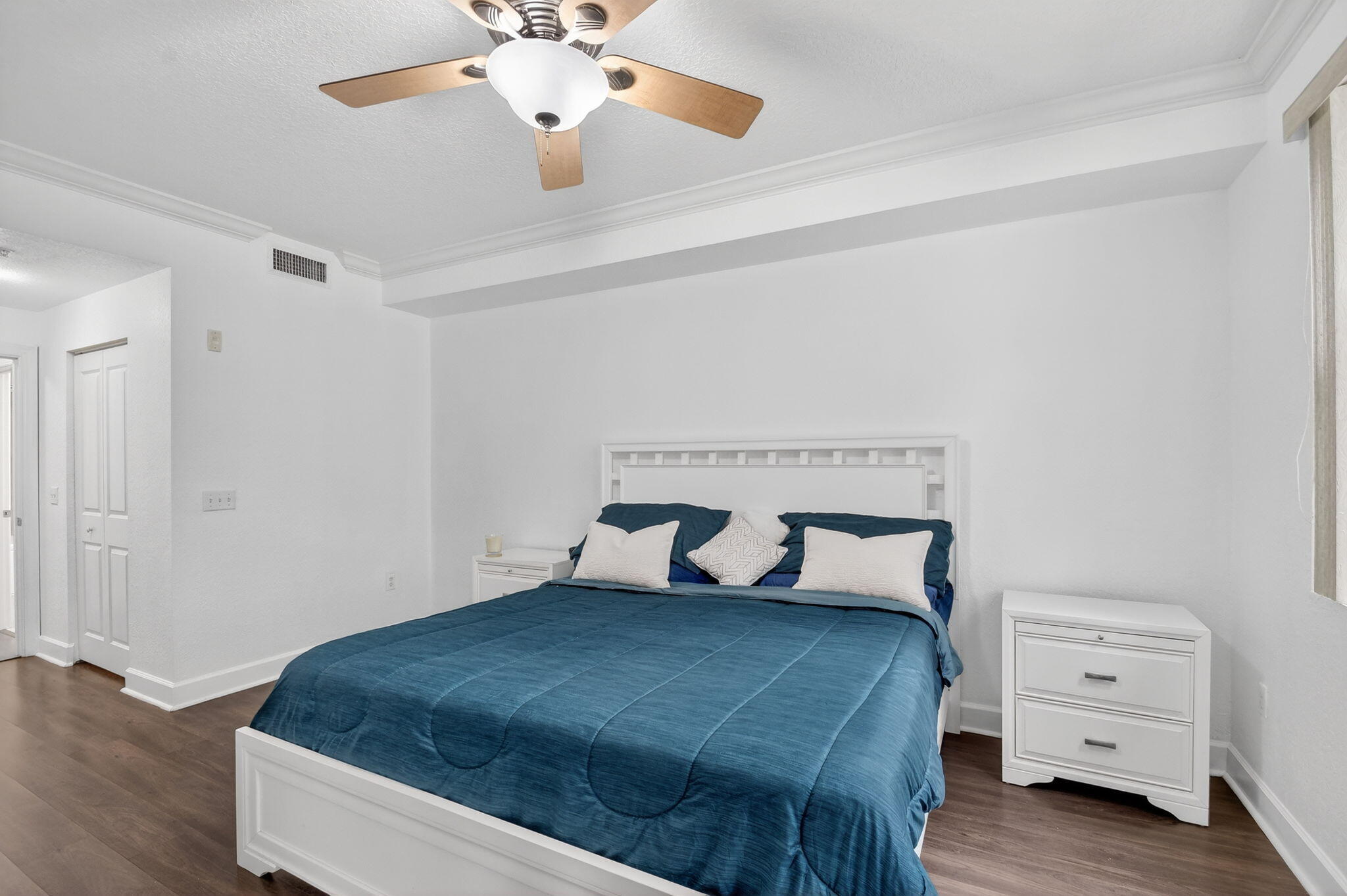 3110 Renaissance Way, Unit 110 Boynton Beach, FL 33426 - Photo 16 of 45 a bedroom with a bed and a dresser