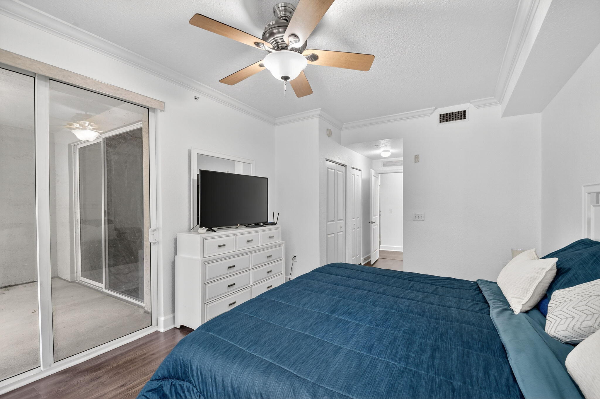 3110 Renaissance Way, Unit 110 Boynton Beach, FL 33426 - Photo 18 of 45 a bedroom with a bed and a flat screen tv