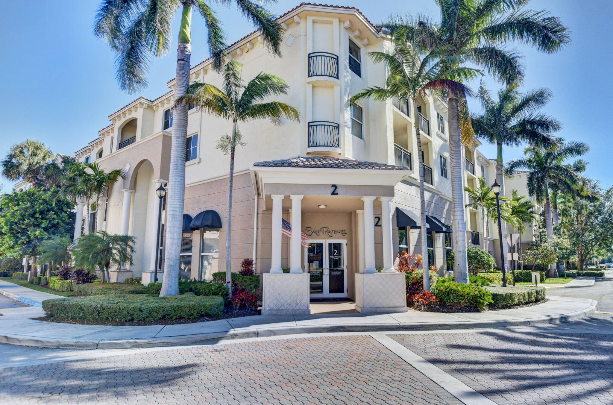 3110 Renaissance Way, Unit 110 Boynton Beach, FL 33426 - Photo 2 of 45 a view of a white apartments with palm trees