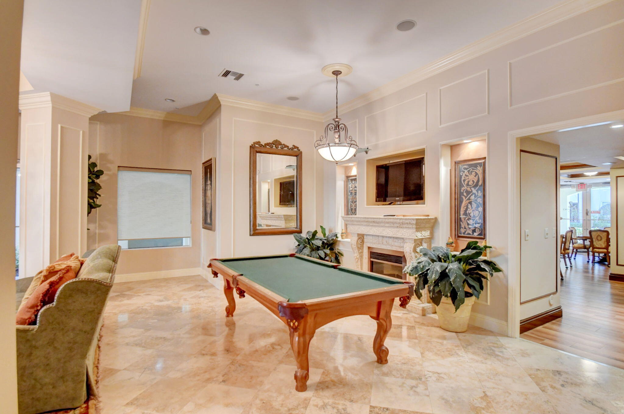 3110 Renaissance Way, Unit 110 Boynton Beach, FL 33426 - Photo 26 of 45 a living room with furniture a flat screen tv and a dining table