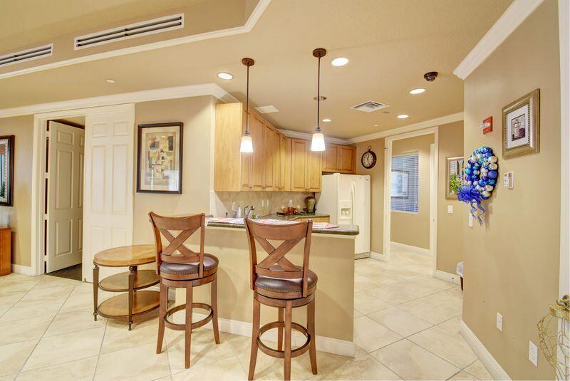 3110 Renaissance Way, Unit 110 Boynton Beach, FL 33426 - Photo 28 of 45 a view of a dining room with furniture