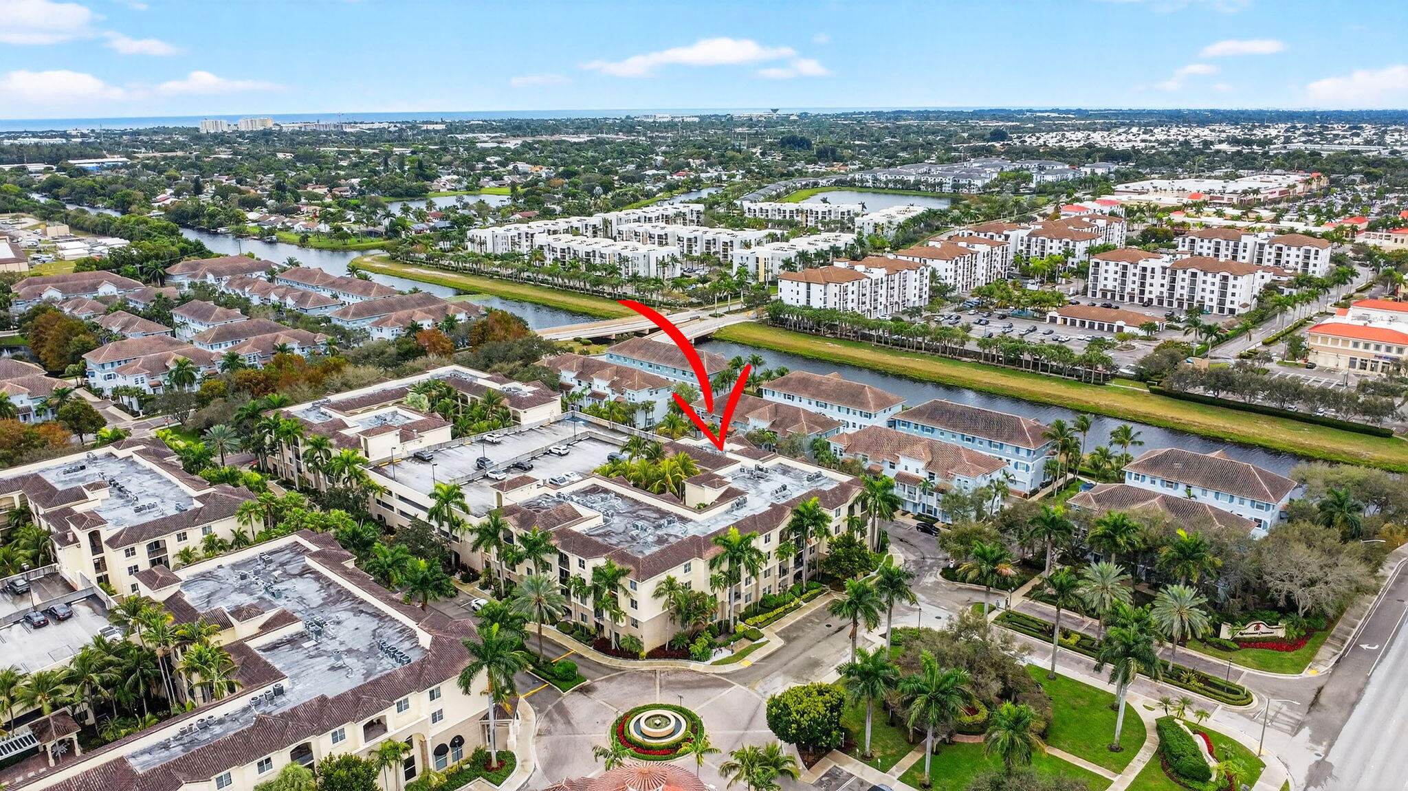 3110 Renaissance Way, Unit 110 Boynton Beach, FL 33426 - Photo 42 of 45 an aerial view of lake and residential houses with outdoor space