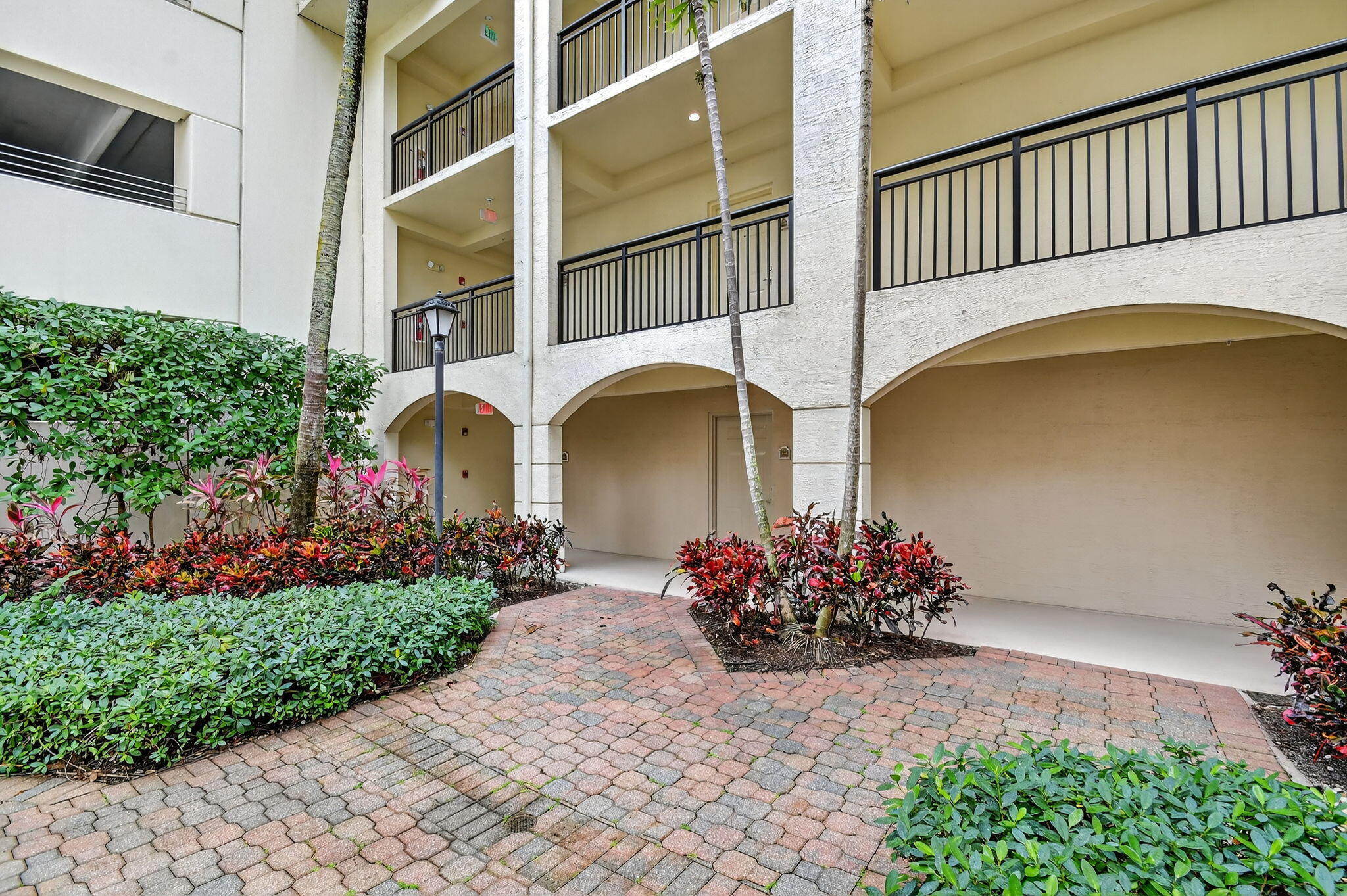 3110 Renaissance Way, Unit 110 Boynton Beach, FL 33426 - Photo 8 of 45 a front view of a house with a garden