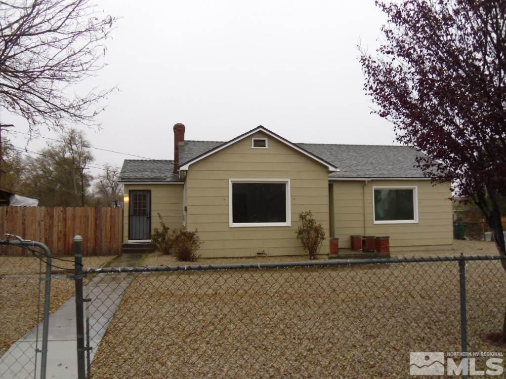 1335 Oliver Avenue Reno, NV 89512 - Photo 1 of 11 a front view of house with yard