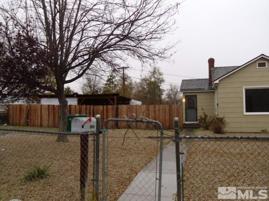 1335 Oliver Avenue Reno, NV 89512 - Photo 2 of 11 a front view of a house with garden