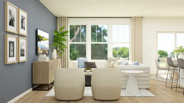 a dining room with furniture and large windows