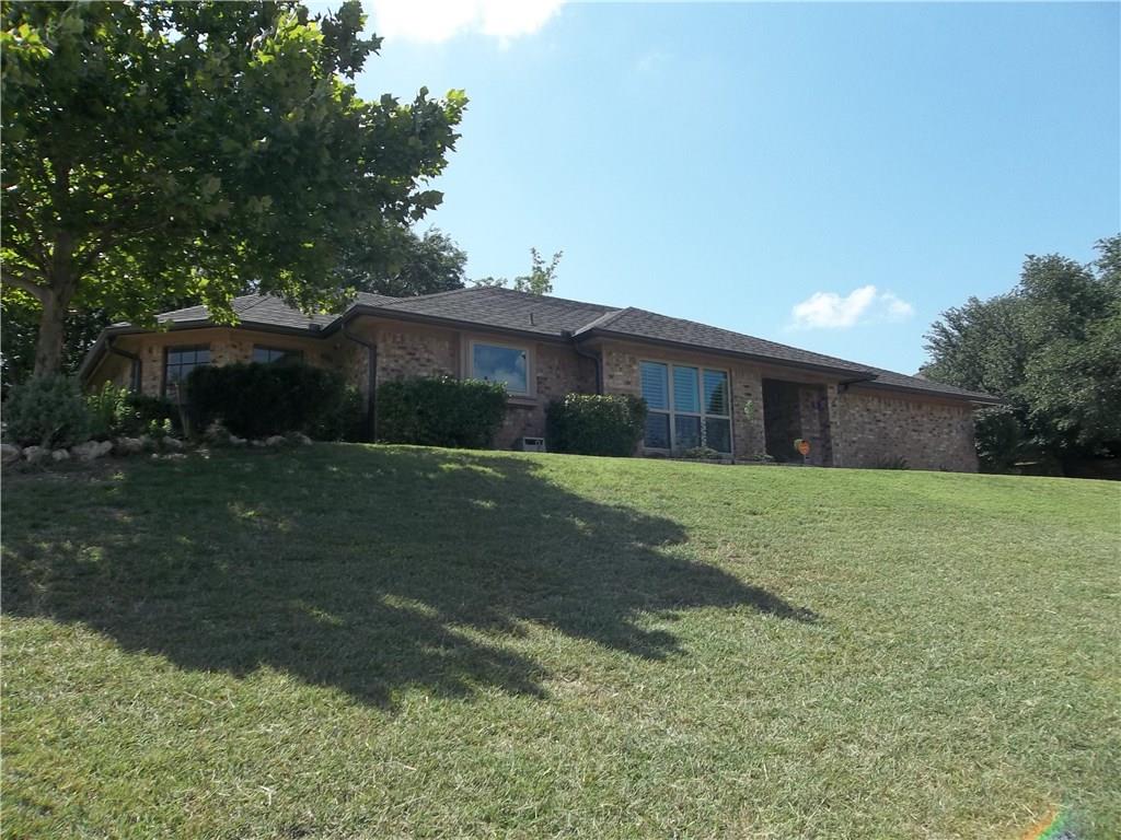 8701 Canyon Crest Road Fort Worth, TX 76179 - Photo 1 of 1 a front view of a house with a yard
