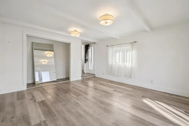 a view of an empty room and window