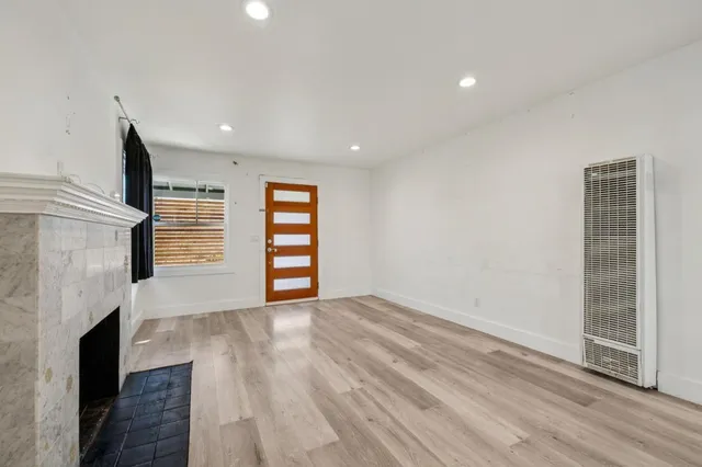 a kitchen with a refrigerator and window