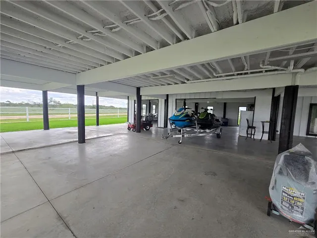 an aerial view of a house with swimming pool outdoor seating and lake view