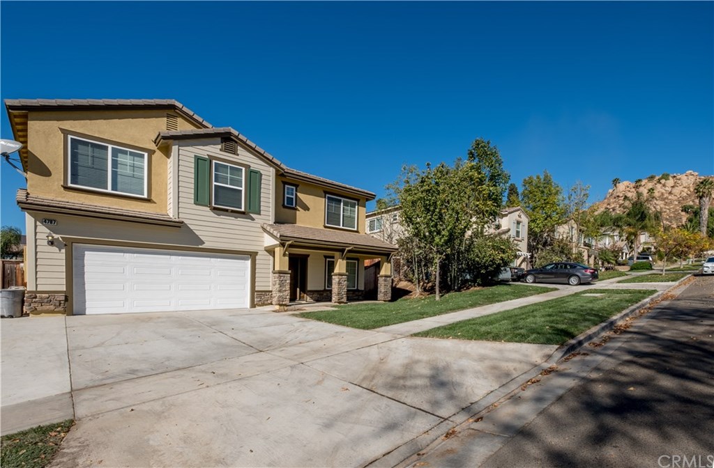 4787 Elderwood Court Riverside, CA 92501 - Photo 1 of 1 a front view of a house with a garden