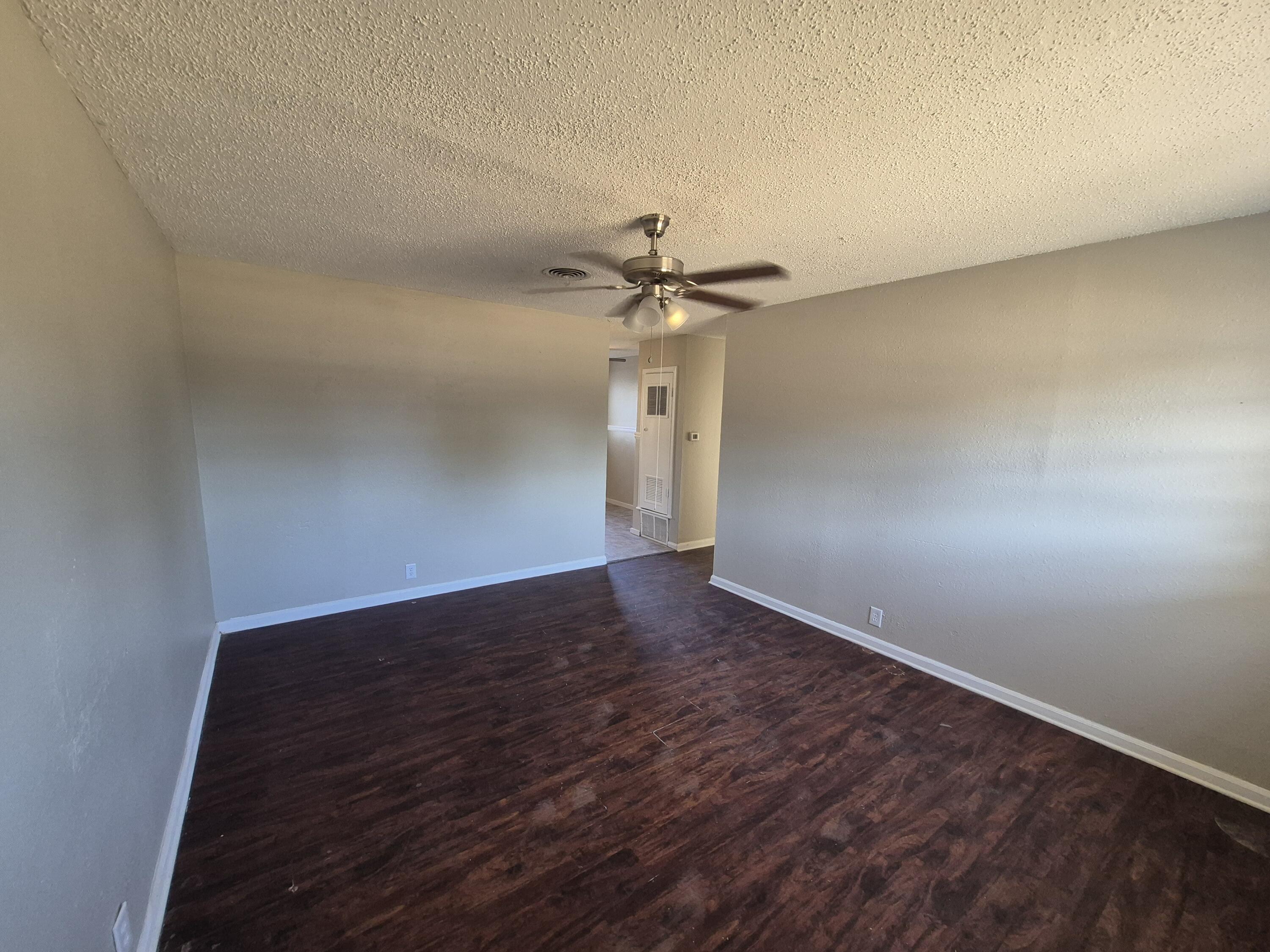 1714 42nd Street Lubbock, TX 79412 - Photo 2 of 16 wooden floor in an empty room