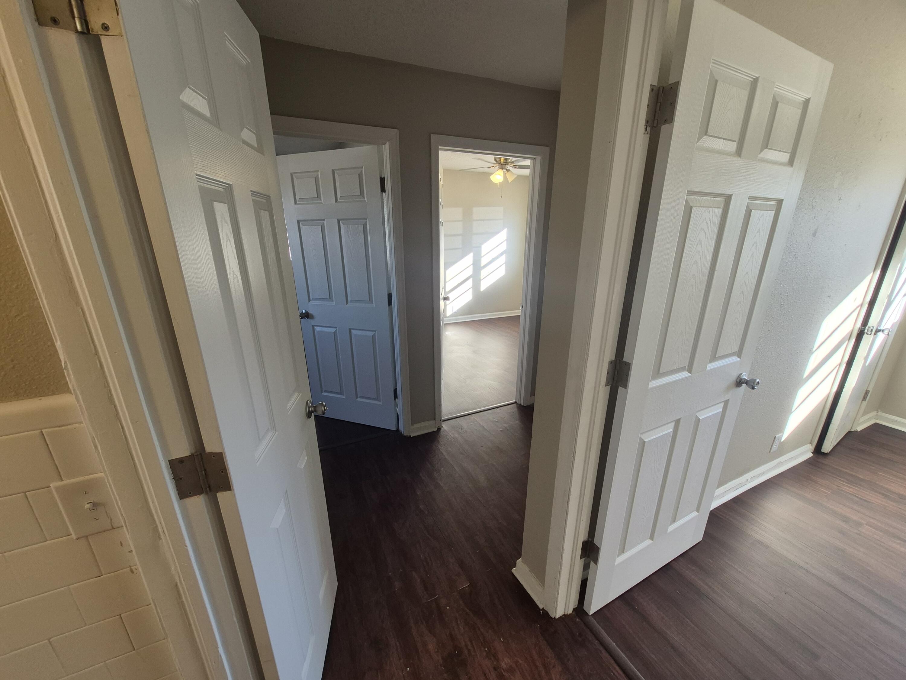 1714 42nd Street Lubbock, TX 79412 - Photo 8 of 16 a view of a hallway with wooden floor