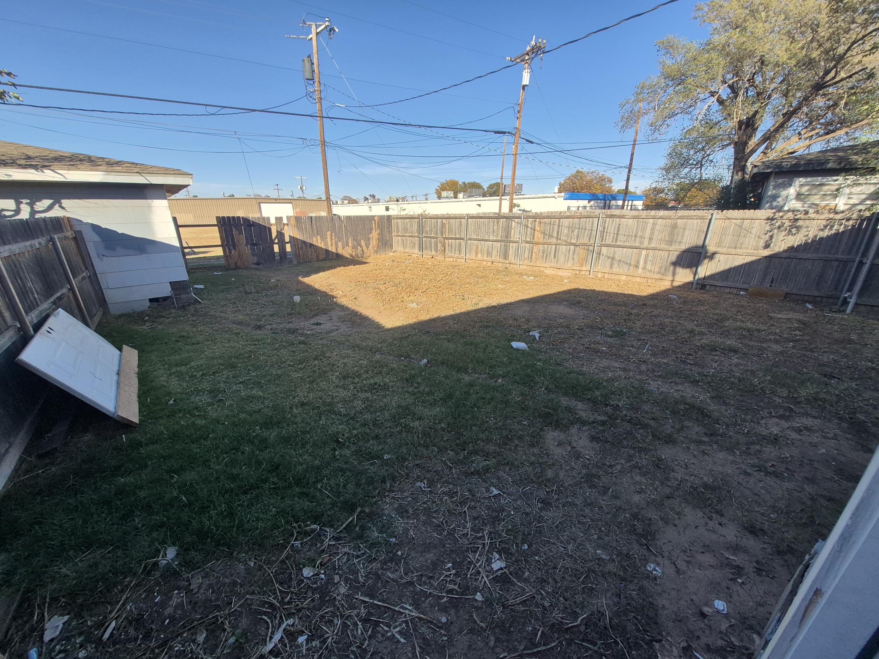 1714 42nd Street Lubbock, TX 79412 - Photo 10 of 16 a view of a backyard with table and chairs