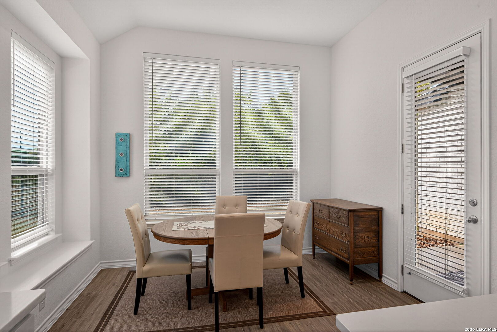 3146 Stokesay Bulverde, TX 78163 - Photo 15 of 30 a view of a dining room with furniture and windows
