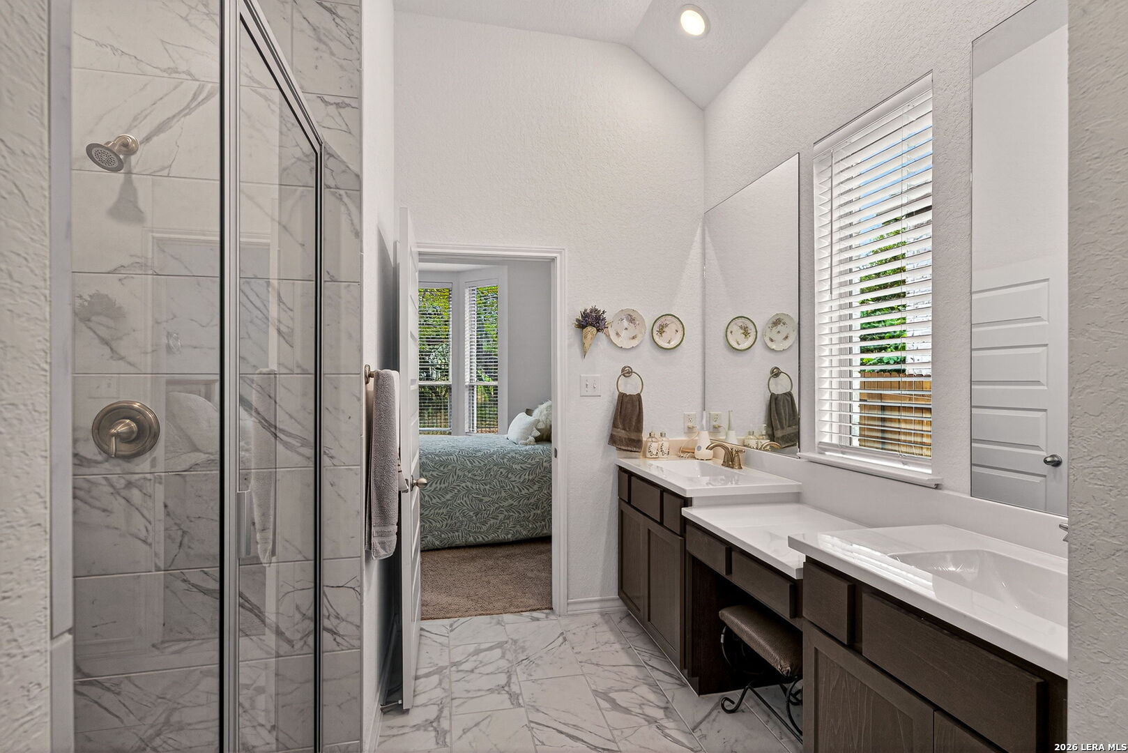 3146 Stokesay Bulverde, TX 78163 - Photo 21 of 30 a en suite bathroom with a granite countertop sink mirror and double