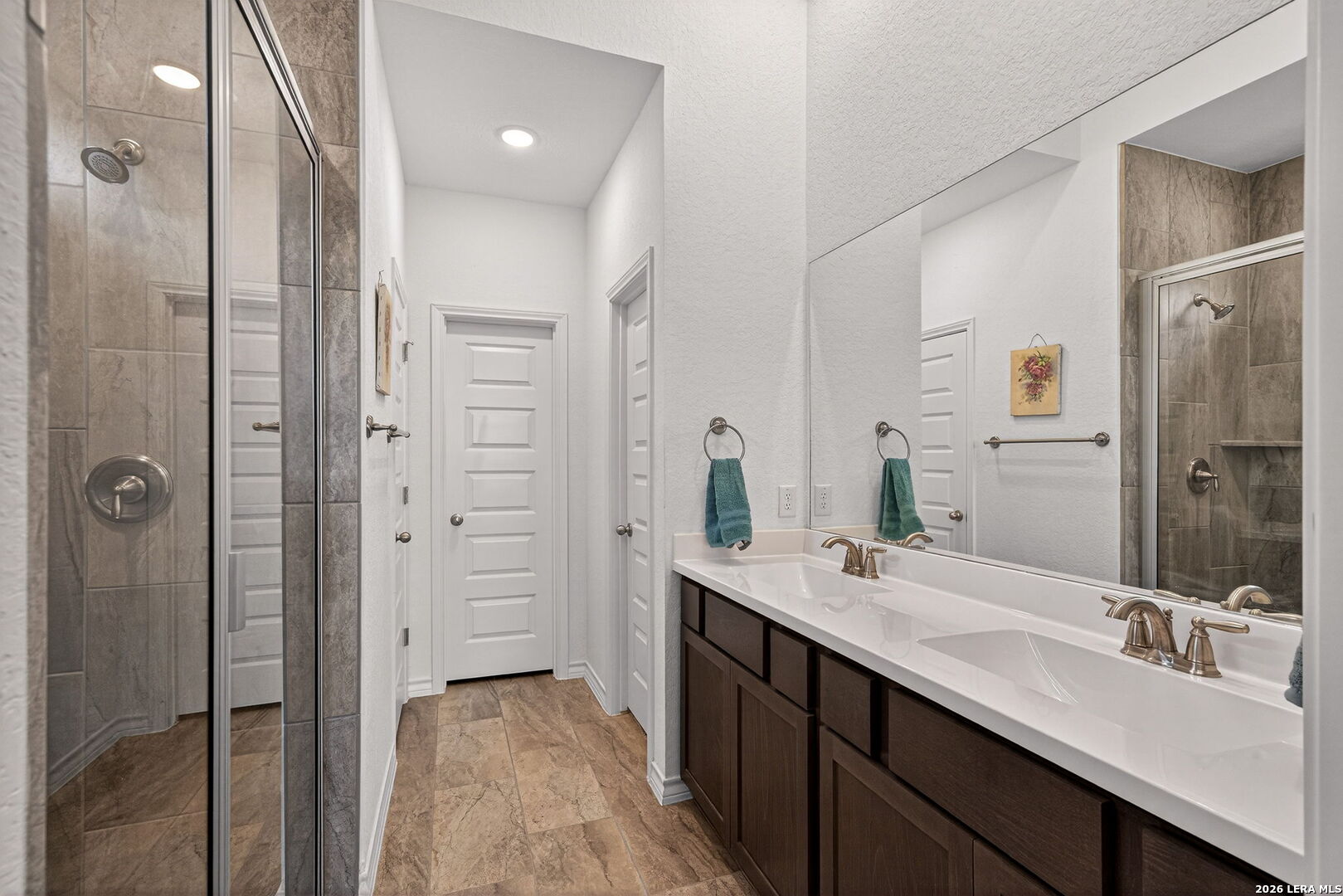3146 Stokesay Bulverde, TX 78163 - Photo 23 of 30 a bathroom with a double vanity sink mirror and double