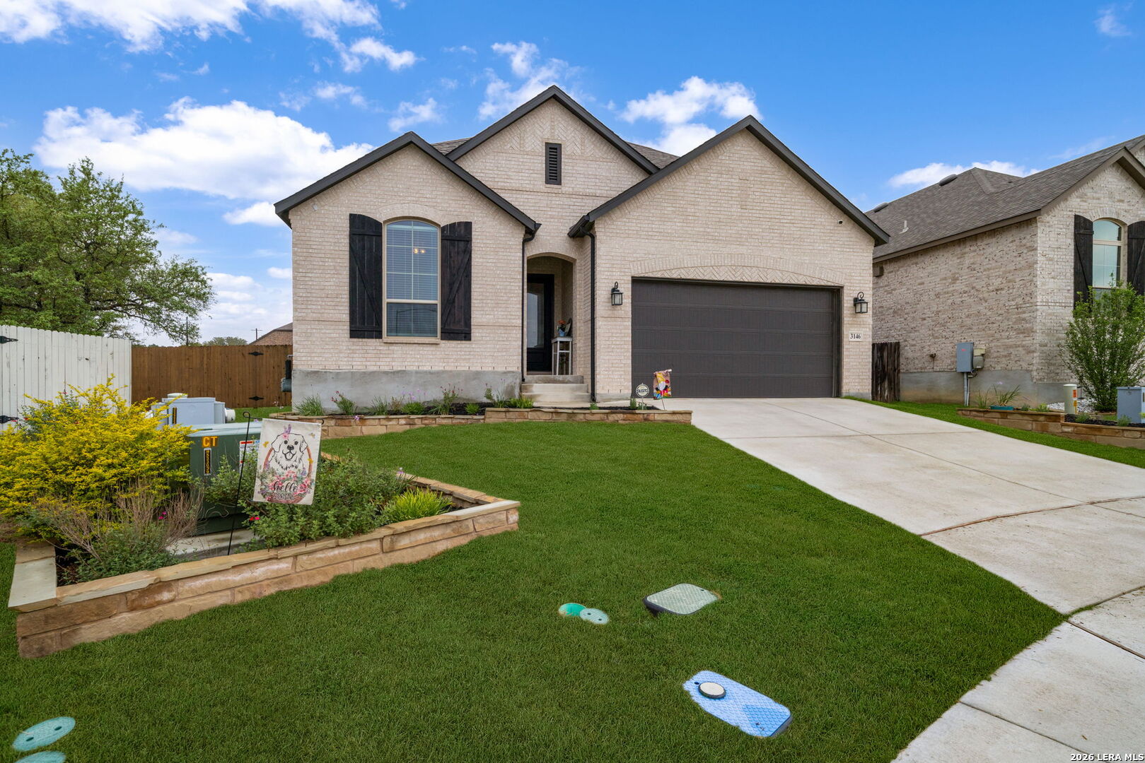 3146 Stokesay Bulverde, TX 78163 - Photo 8 of 30 a front view of a house with a garden and yard