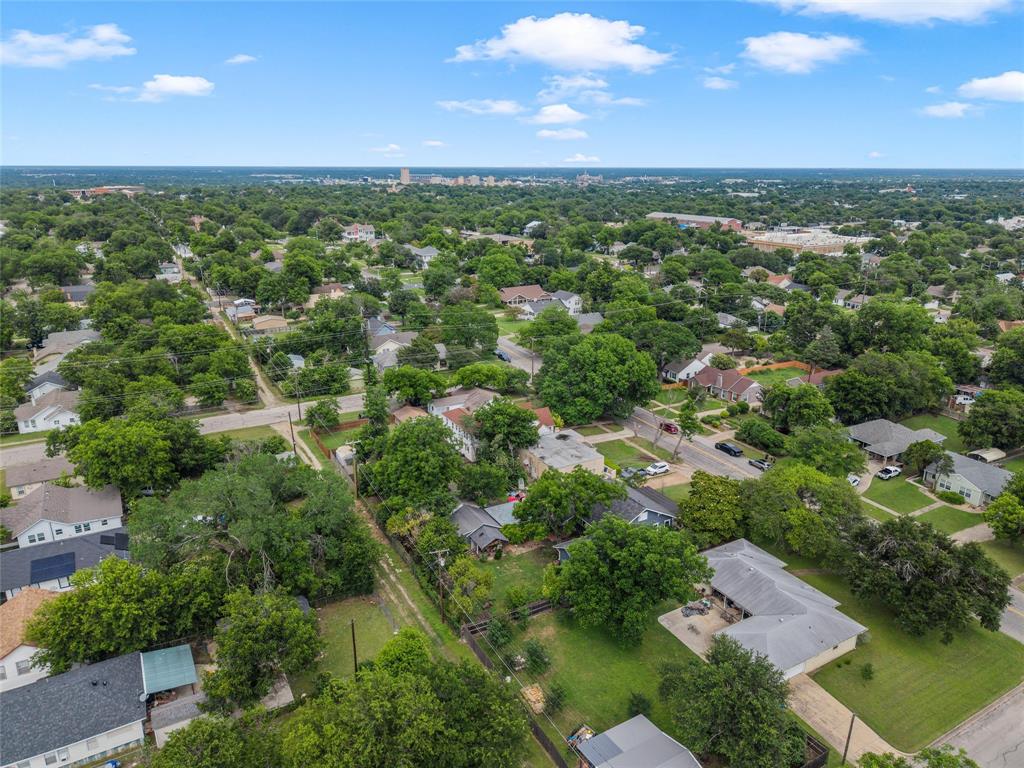 2717 Colcord Avenue Waco, TX 76707 - Photo 28 of 34 an aerial view of residential houses with outdoor space and trees