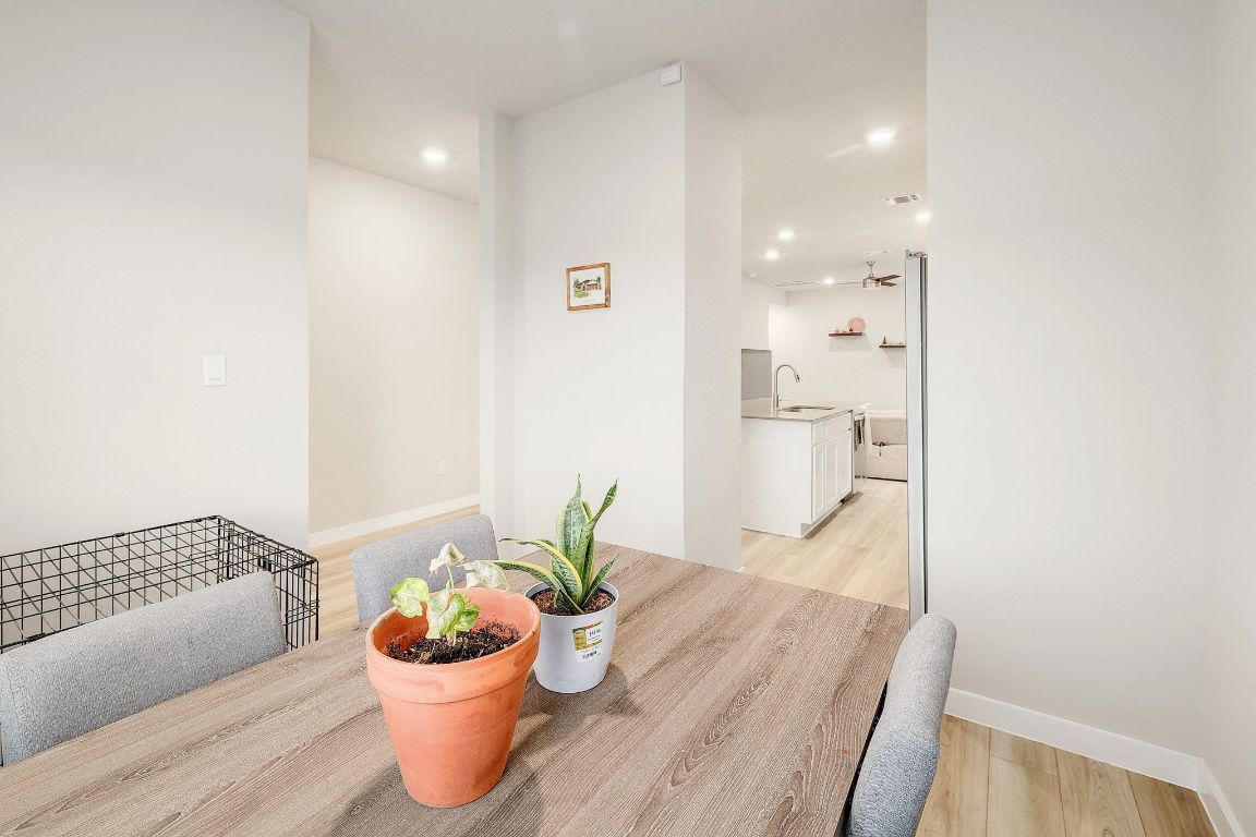 204 Halford Road Georgetown, TX 78633 - Photo 12 of 27 a dining room with furniture and a potted plant