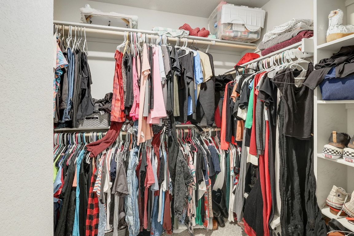 204 Halford Road Georgetown, TX 78633 - Photo 17 of 27 a view of walk in closet with clothes
