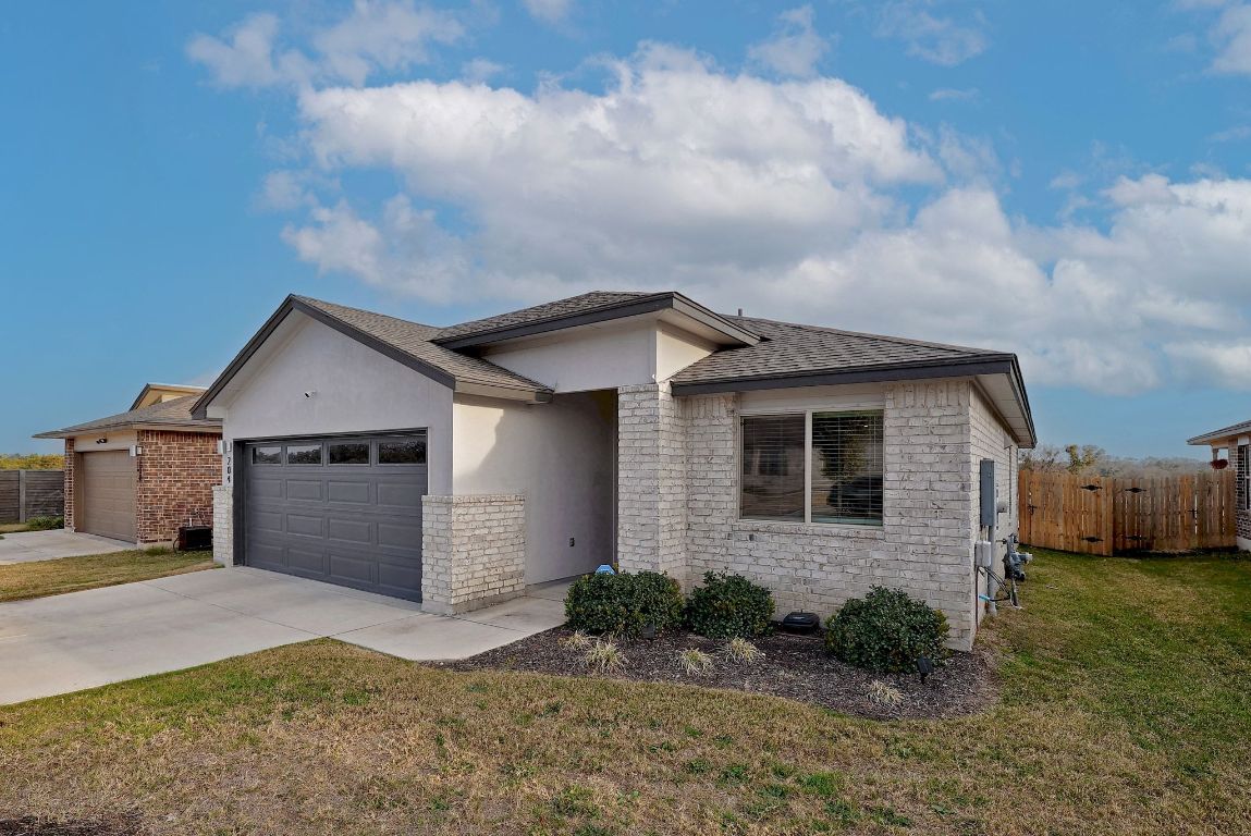 204 Halford Road Georgetown, TX 78633 - Photo 3 of 27 a view of a house with a yard and garage